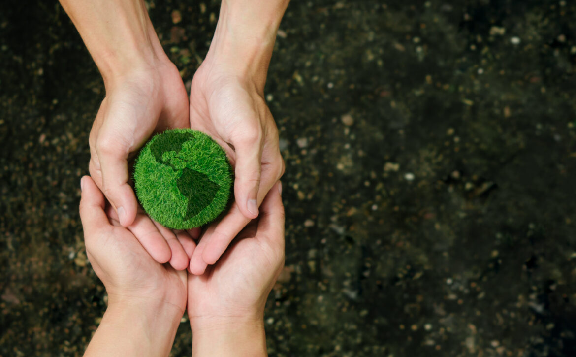 Net Zero and Carbon Neutral Concepts.Close up hands holding the