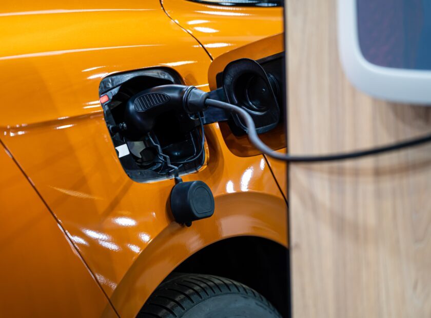 electric car connected to the charger, eco friendly technology,